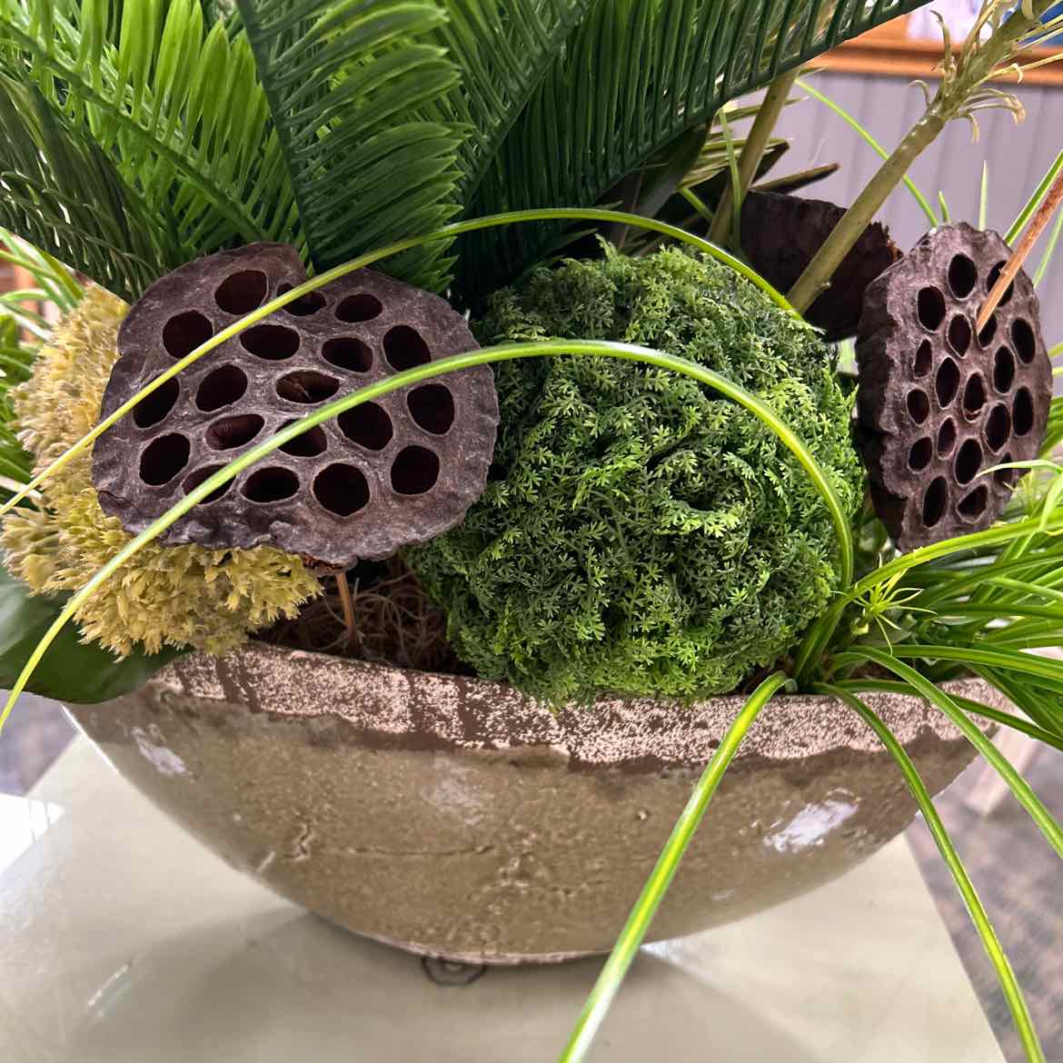 Oval Container of Faux Greenery