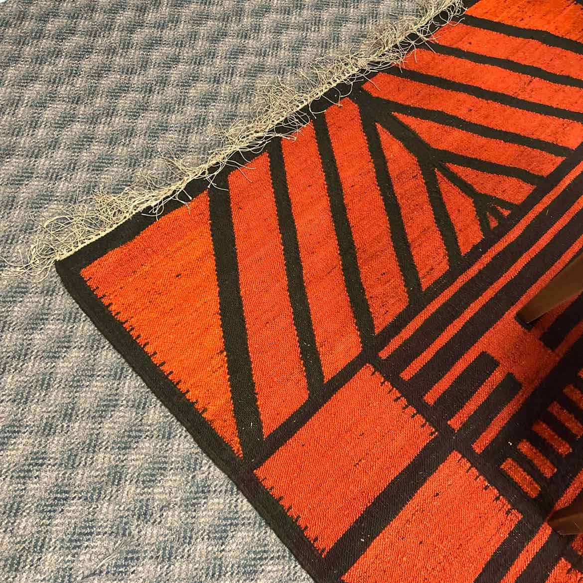 50 x 99" Burnt Orange & Black Rug